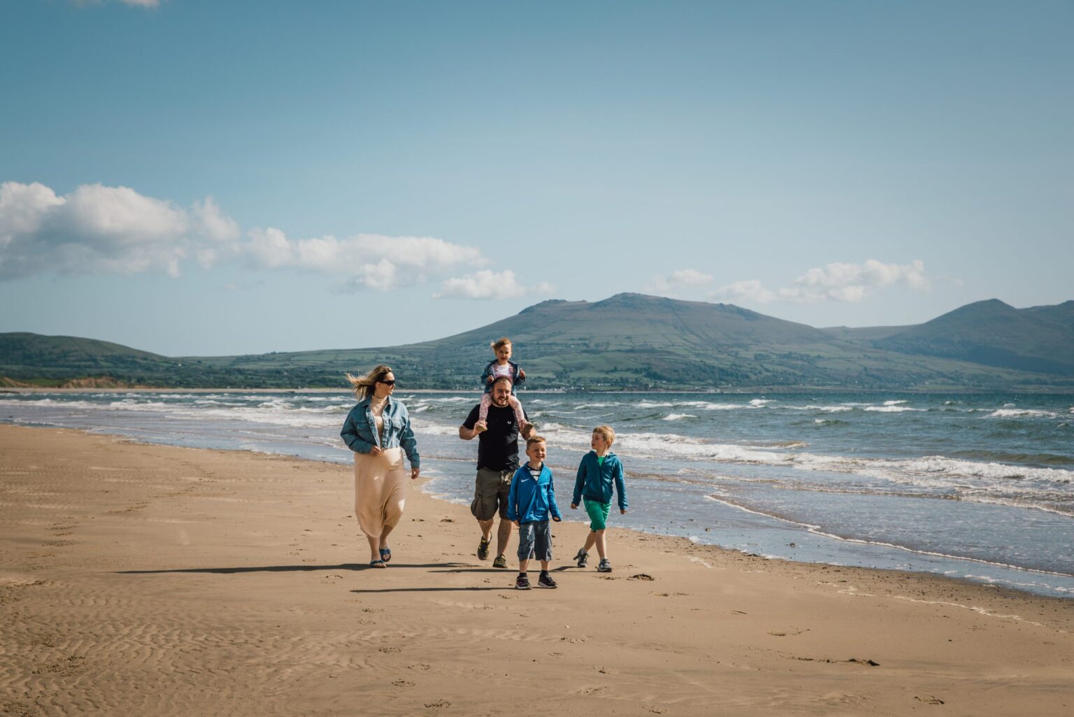 Family walking on beach